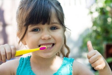 Girl brushing her teeth